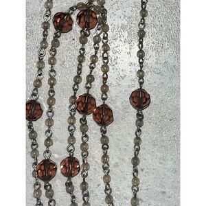 Necklace purple brown light shows tiger eye design